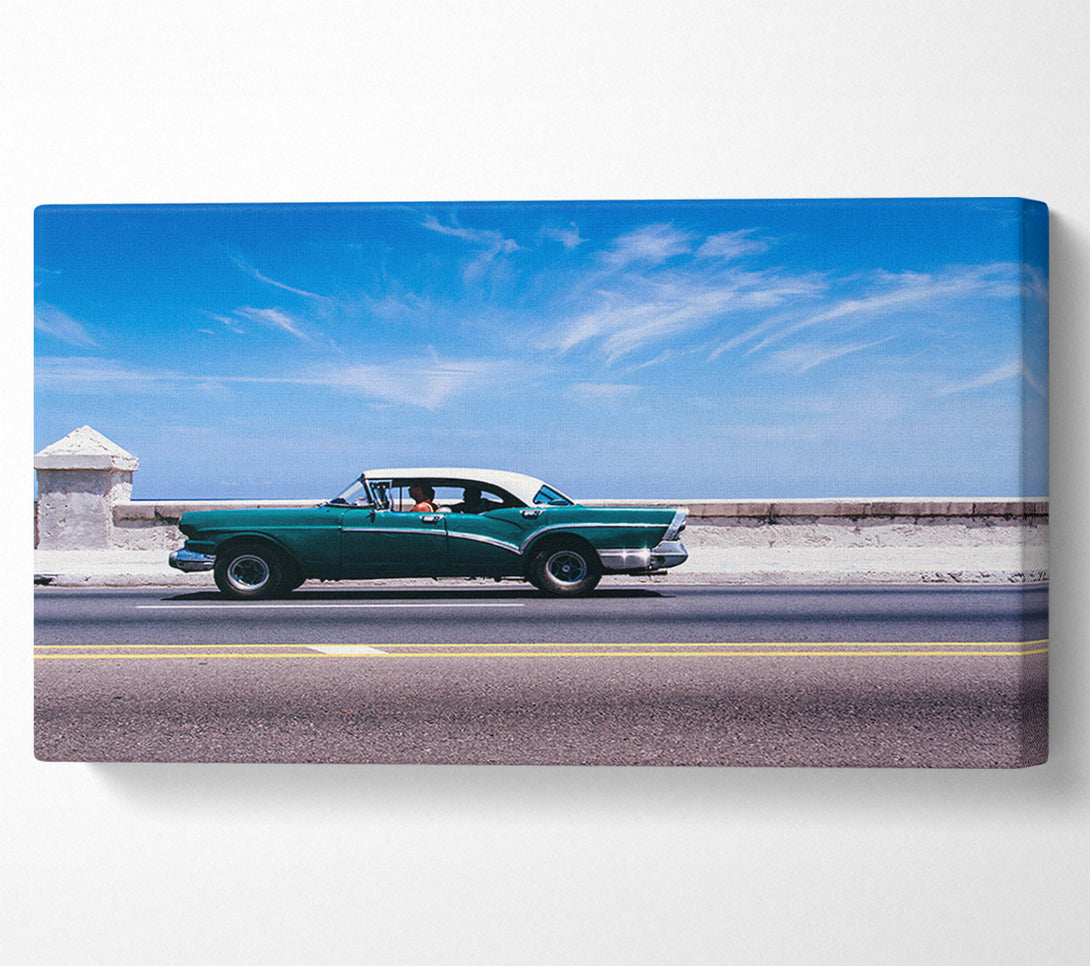 A Canvas Print of Classic car down the highway Canvas Print