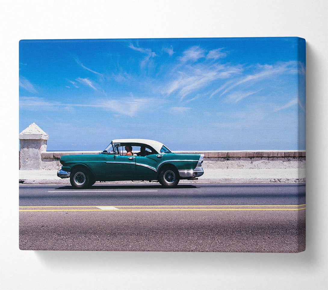  A Canvas Print of Classic car down the highway Canvas Print