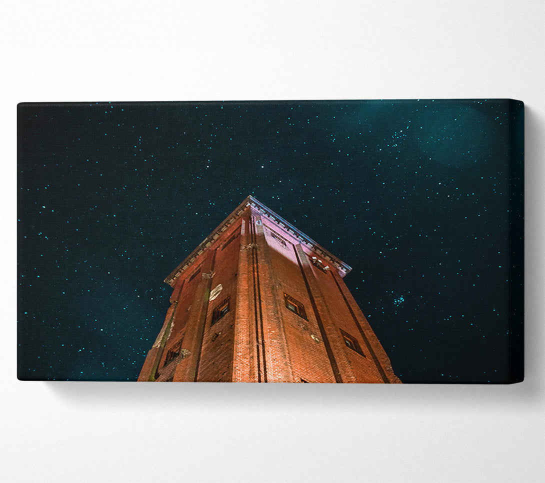  A Canvas Print of Brick Tower Under Stars Canvas Art