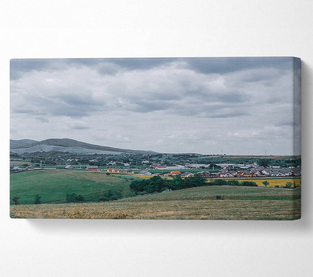  A Canvas Print of Green Hills Under Grey Skies Canvas Print