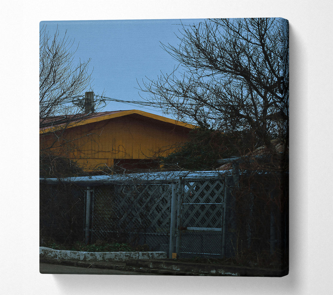  A Canvas Print of Yellow House Behind Branches Canvas Art