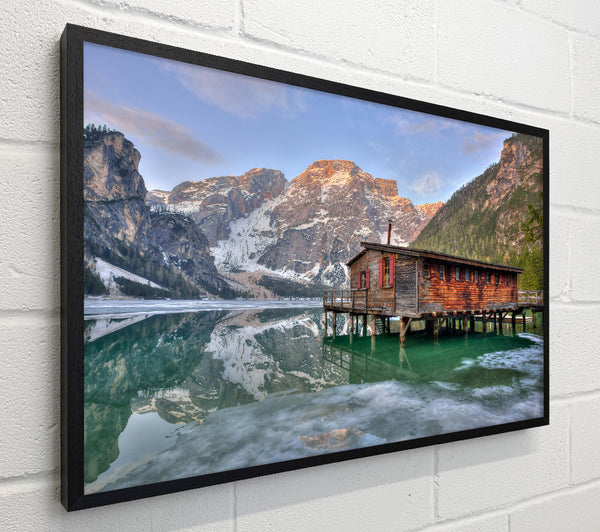 Green Cabin Reflects Mountains