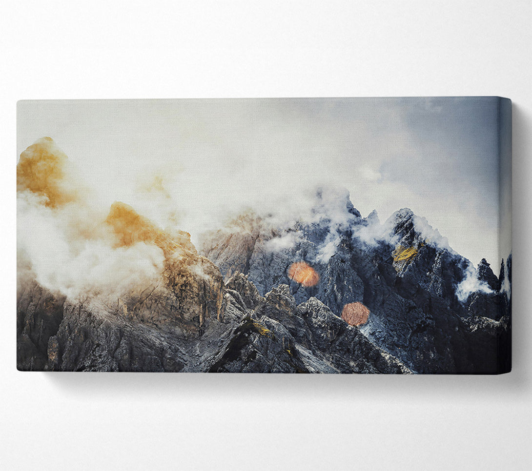  A Canvas Print of Golden Peaks In Fog Canvas Print