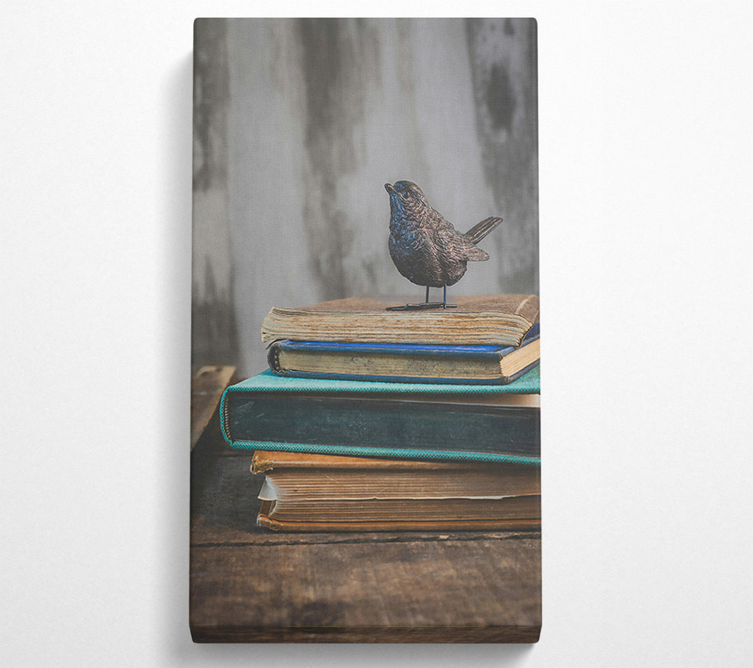  A Canvas Print of Teal Bird On Books Canvas Print