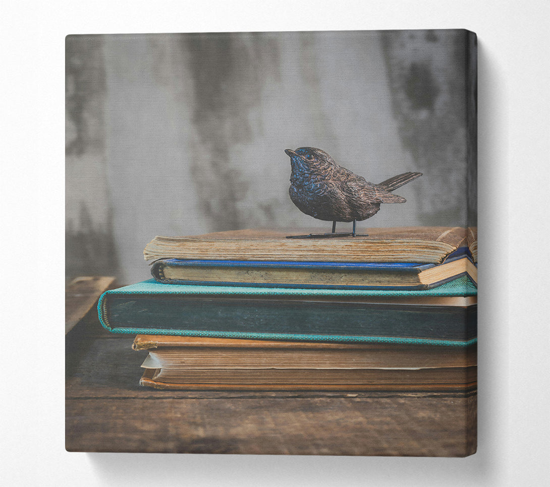  A Canvas Print of Teal Bird On Books Canvas Print
