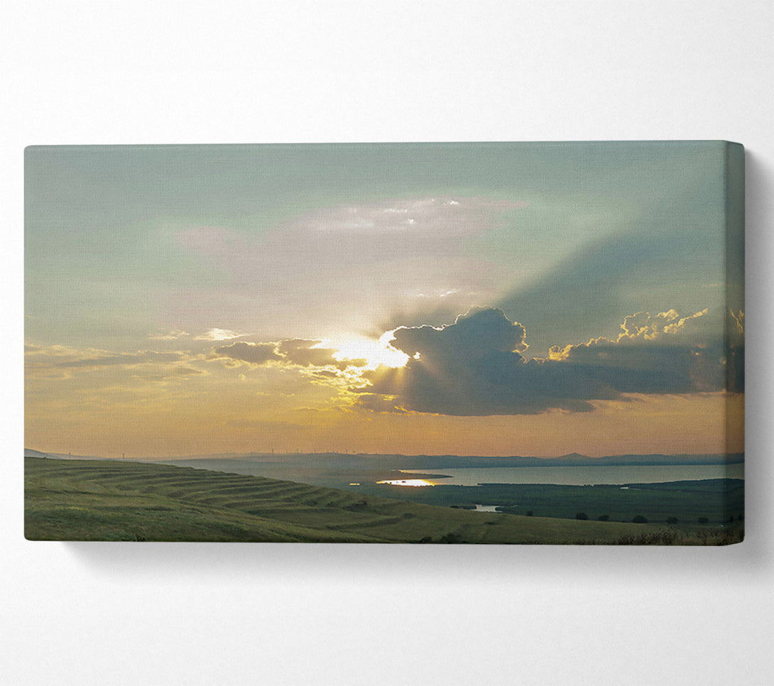  A Canvas Print of Golden Rays Through Clouds Canvas Print