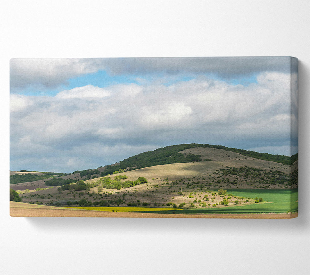  A Canvas Print of Green Hills Under Clouds Canvas Print