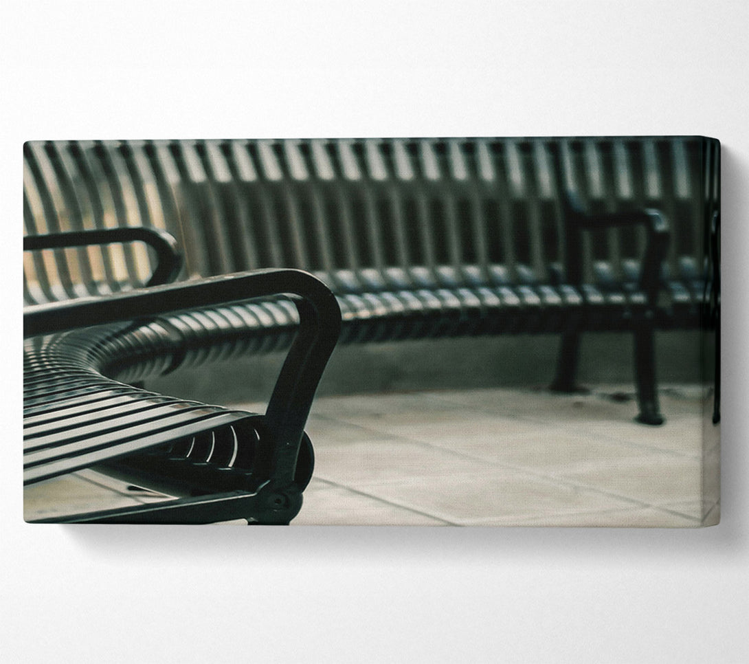  A Canvas Print of Black Metal Bench Rows Canvas Print