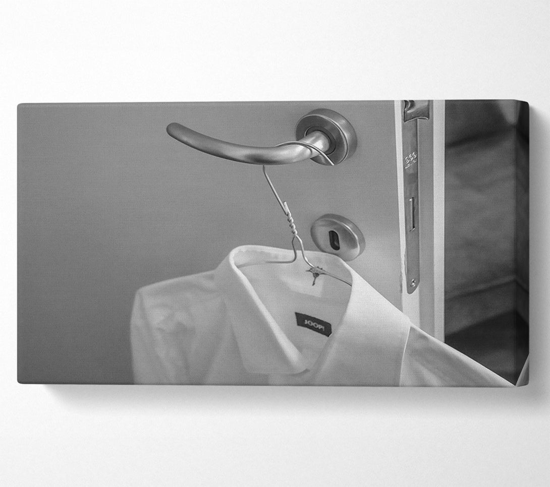  A Canvas Print of White Shirt On A Door Handle Canvas Print