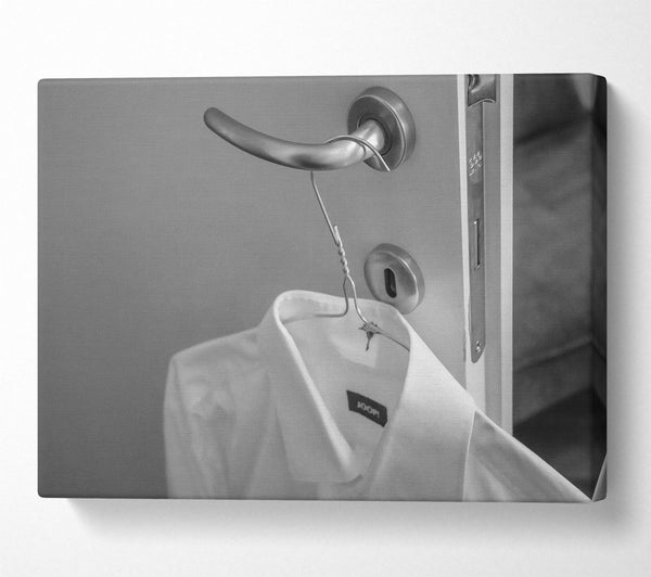  A Canvas Print of White Shirt On A Door Handle Canvas Print
