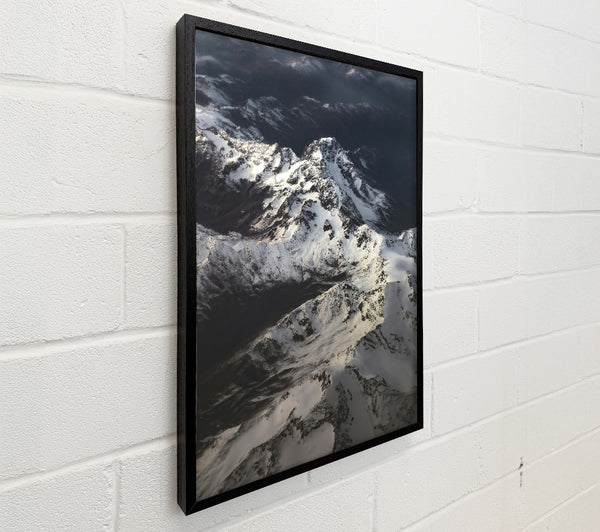 White Peaks Above Grey