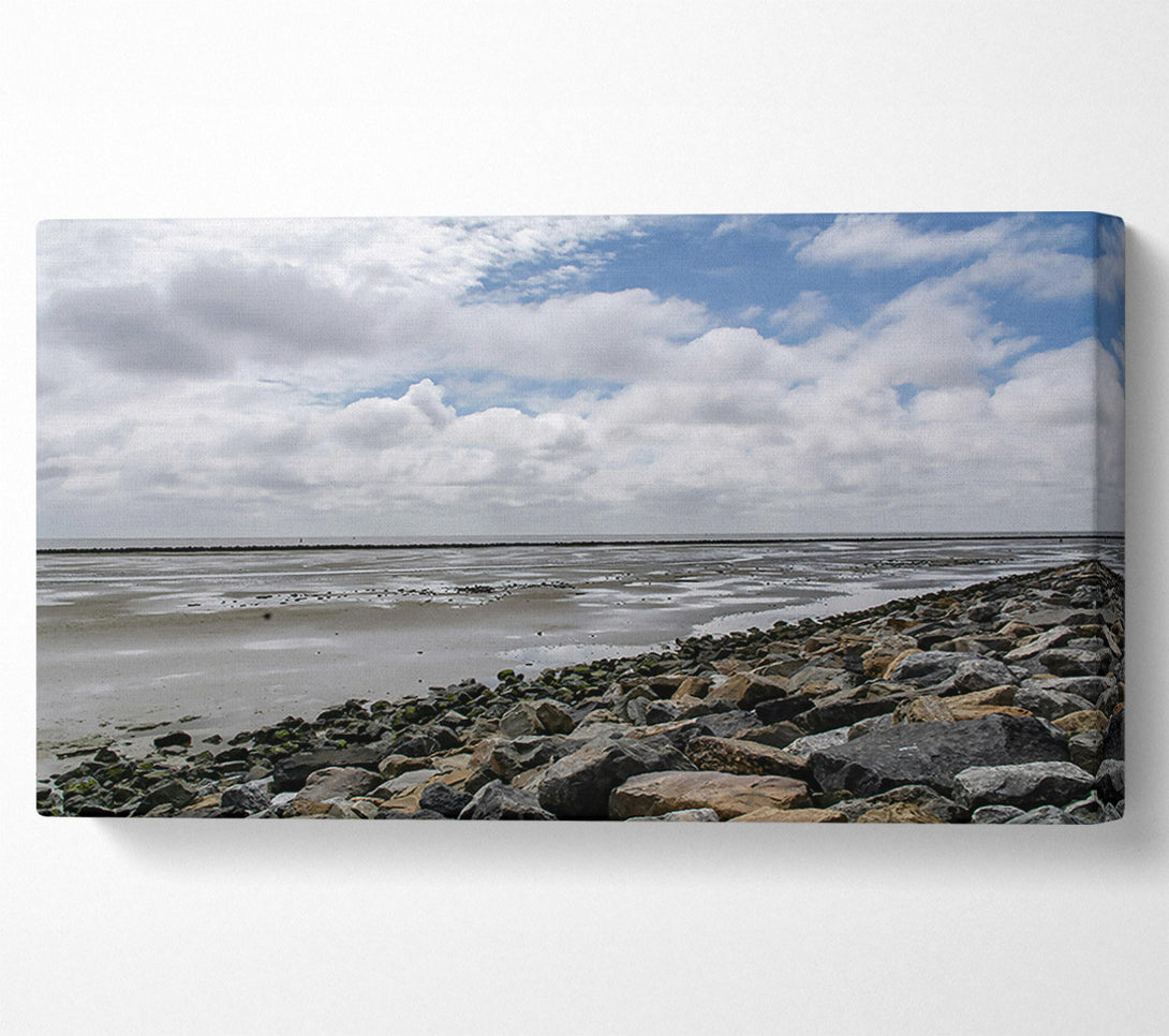  A Canvas Print of Grey Sky, Rocky Shore Canvas Print