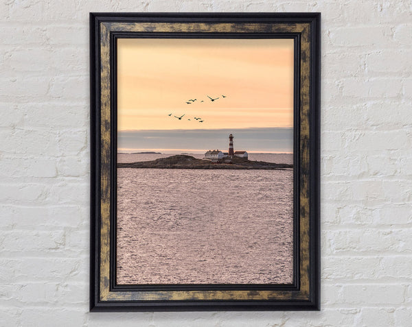 Distant Lighthouse With Birds Flying Framed Print
