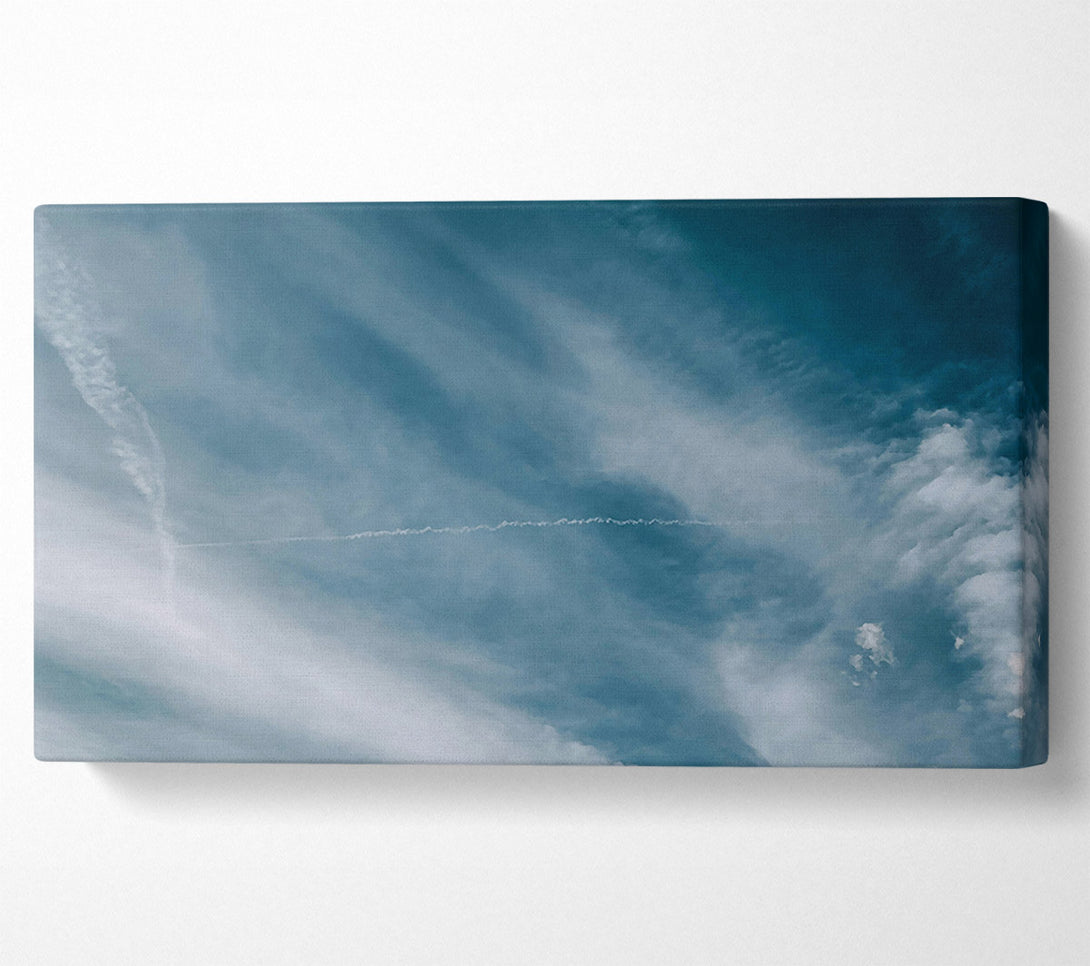  A Canvas Print of Teal Sky Trails Canvas Print