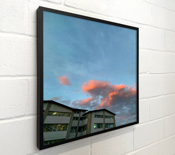 Pink Clouds Over Cityscape