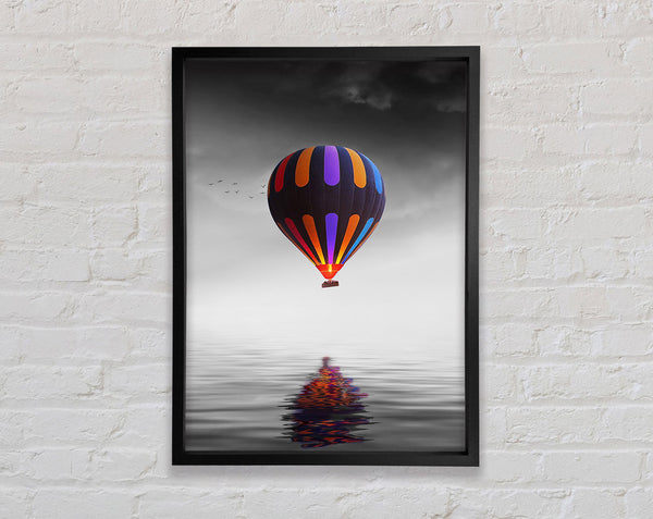 Hot Air Balloon Over A Grey Sea Framed Print