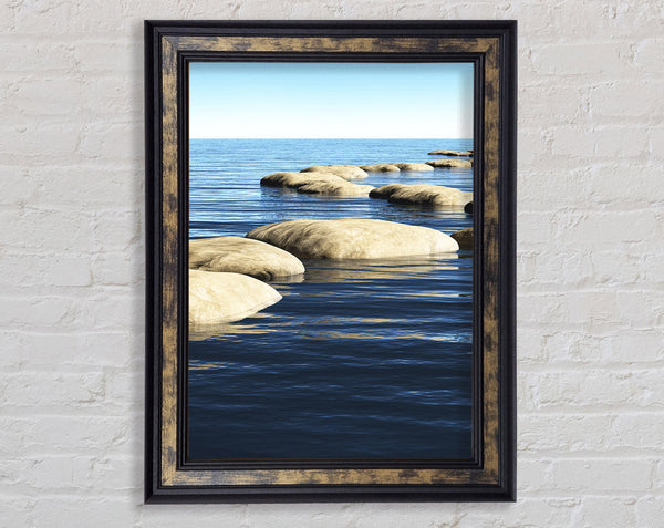 Rocks In The Calm Sea Framed Print
