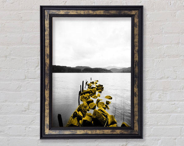 Rocks In To The Lake Framed Print