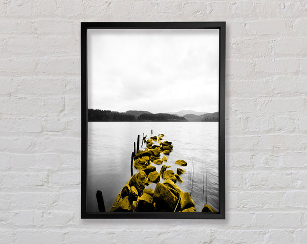 Rocks In To The Lake Framed Print