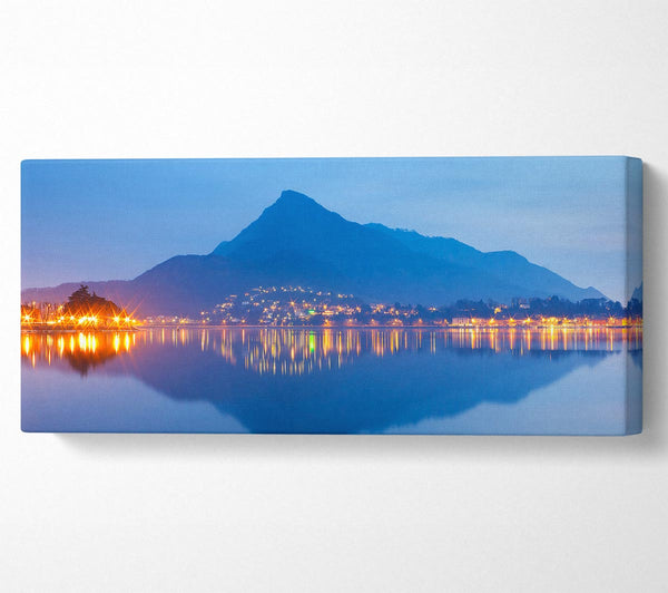 The Blue Mountain Reflects In The Tranquil Ocean