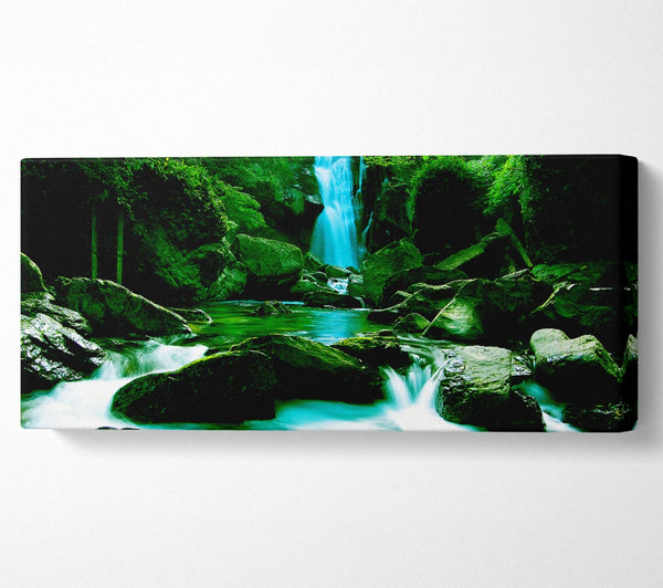 The Waterfall Flows Over The Rocks