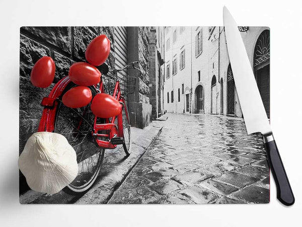 Red Bicycle In The Cobbled Streets Glass Chopping Board