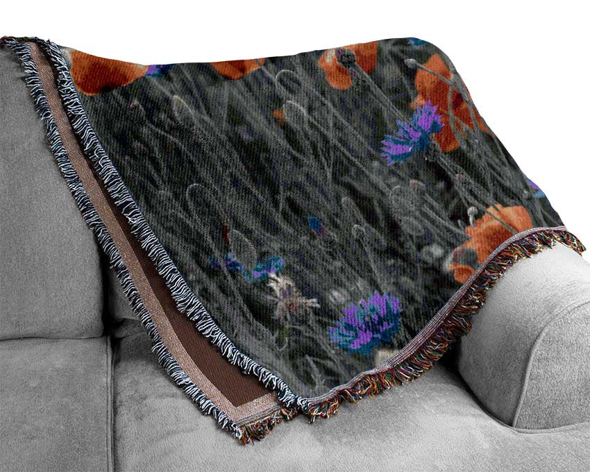 Red poppies blue field Woven Blanket