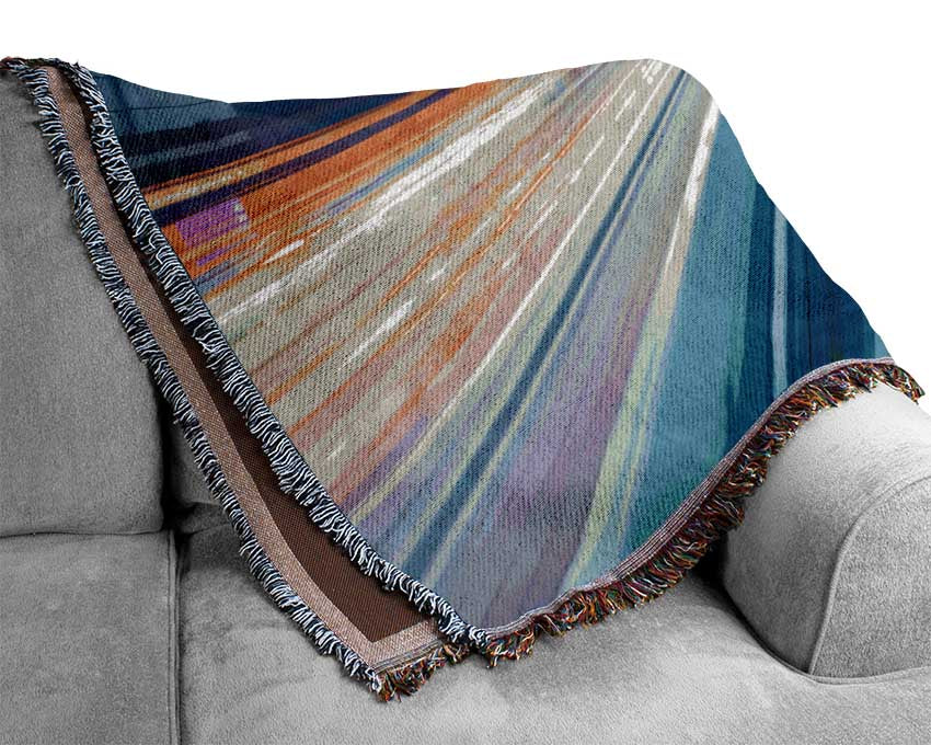 Tunnel of light and colour Woven Blanket