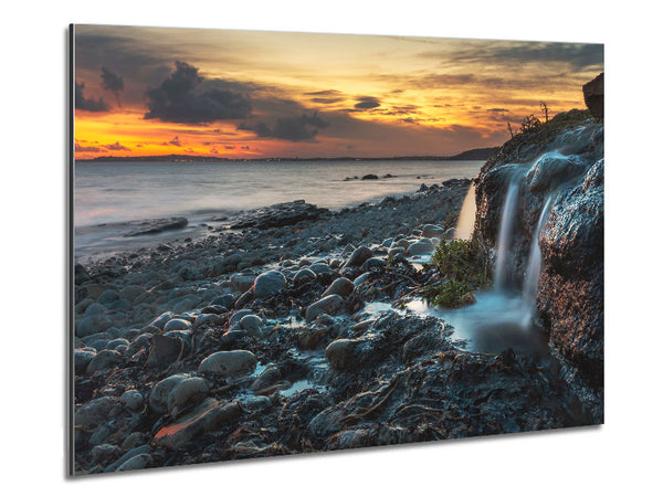 Water flows down the rocks into the sea Metal Print
