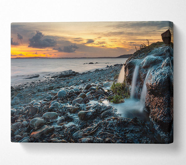  A Canvas Print of Water flows down the rocks into the sea Canvas Wall Art