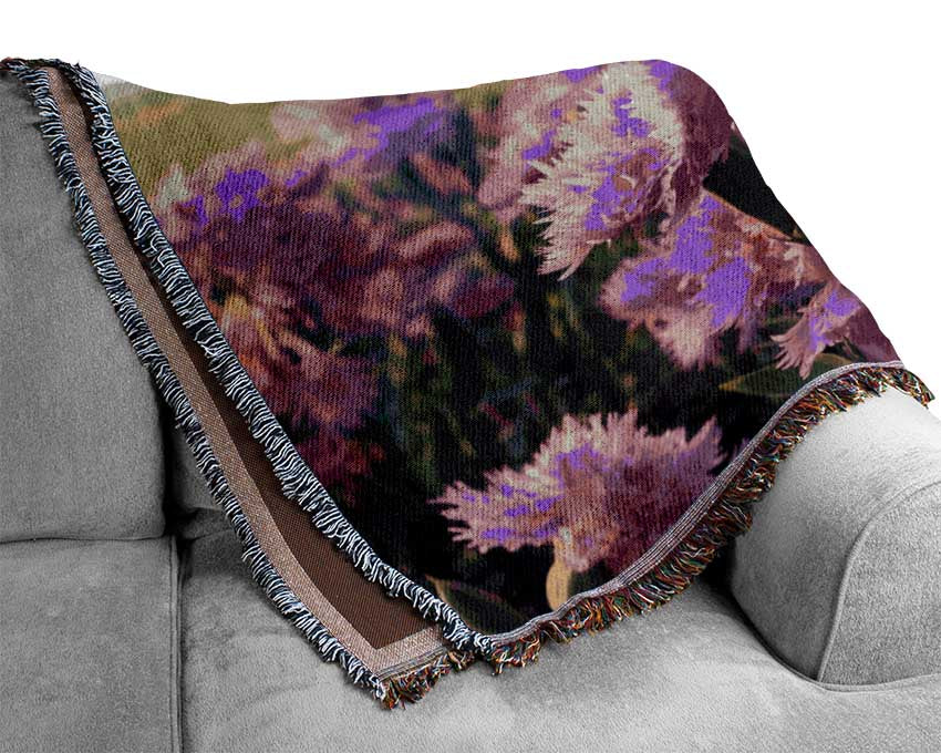 Pink flowers in the countryside Woven Blanket