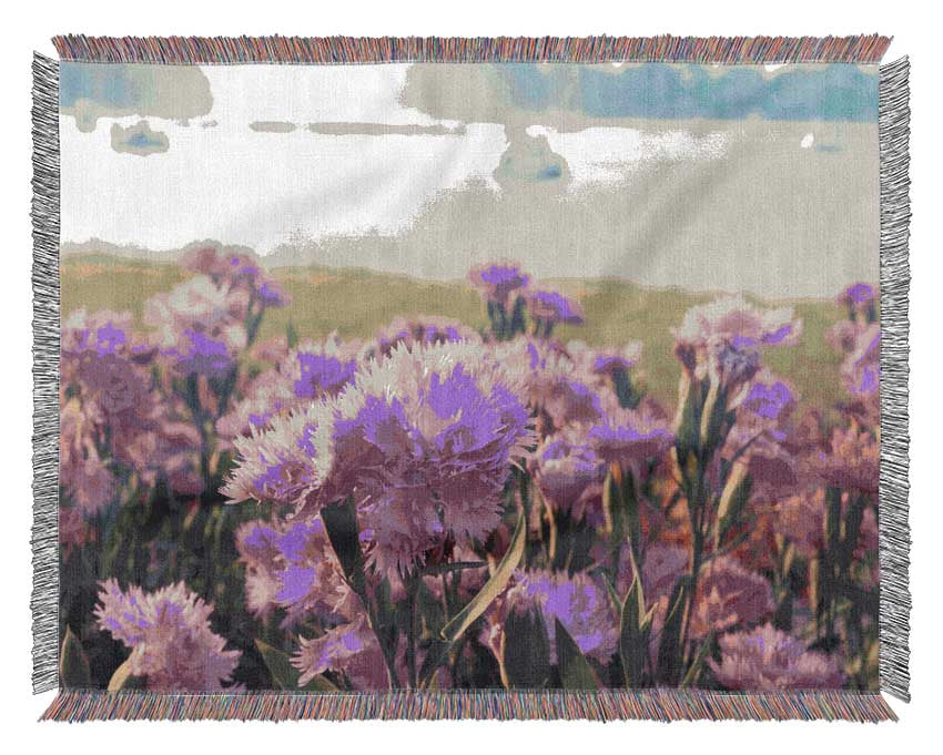Pink flowers in the countryside Woven Blanket