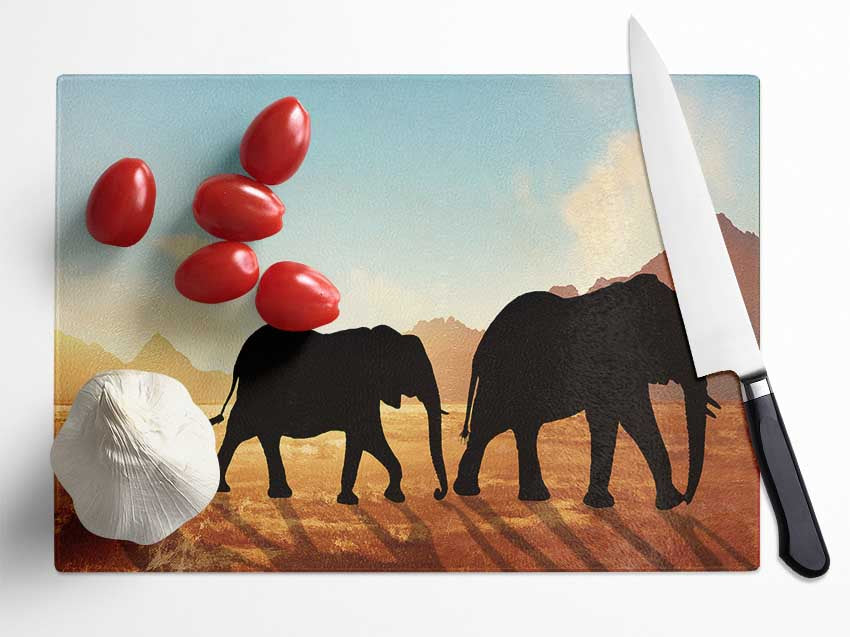 Elephants sillouette walking Glass Chopping Board