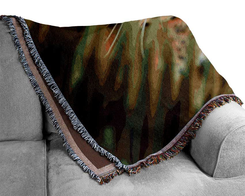 Fierce leopard in the grass Woven Blanket
