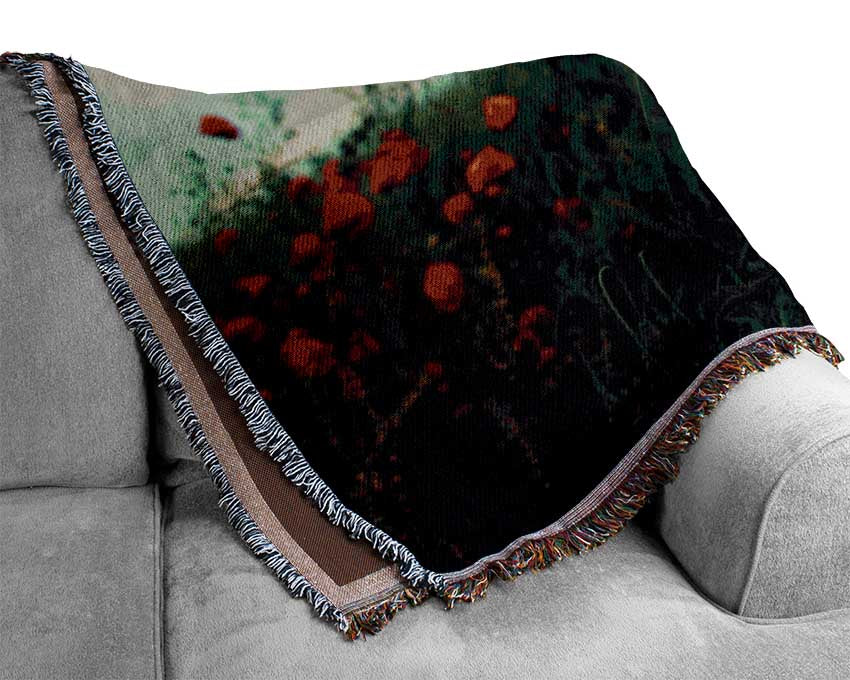 Red poppies on a windy day Woven Blanket