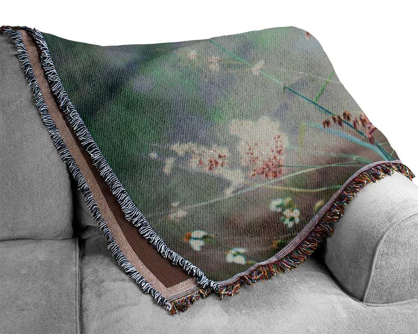 Peach coloured flowers in the morning meadow Woven Blanket
