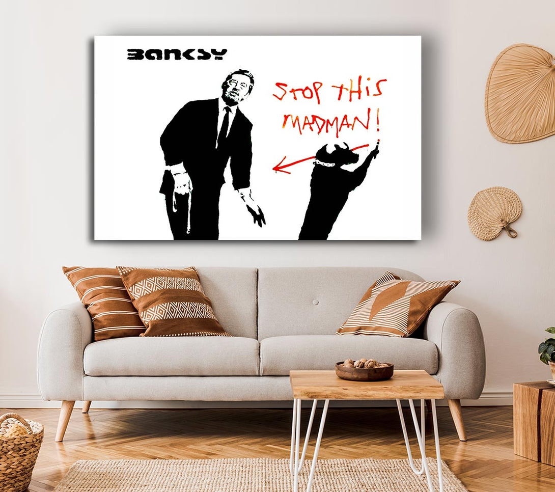  A Canvas Print of Banksy Stop This Madman Canvas Print
