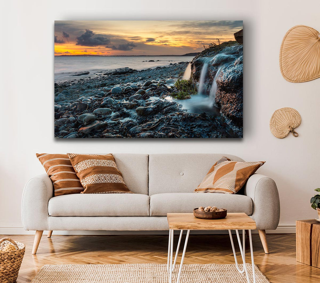  A Canvas Print of Water flows down the rocks into the sea Canvas Wall Art