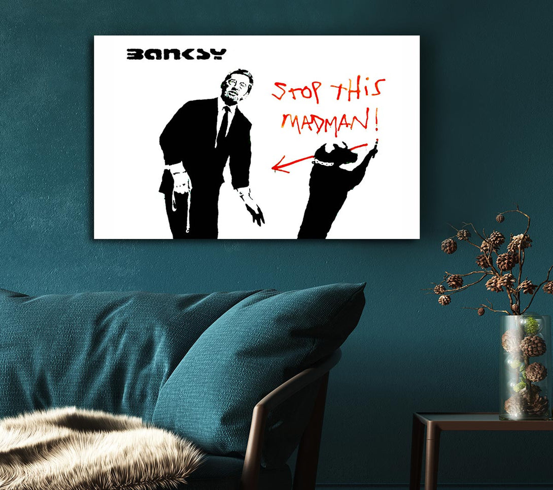  A Canvas Print of Banksy Stop This Madman Canvas Print