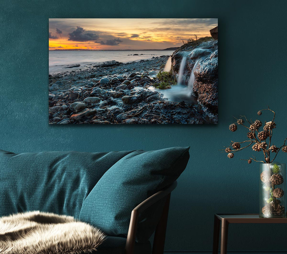  A Canvas Print of Water flows down the rocks into the sea Canvas Wall Art