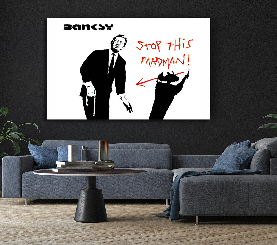  A Canvas Print of Banksy Stop This Madman Canvas Print