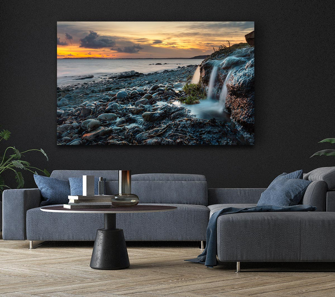  A Canvas Print of Water flows down the rocks into the sea Canvas Wall Art